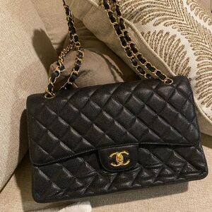 Black handbag. Never carried.